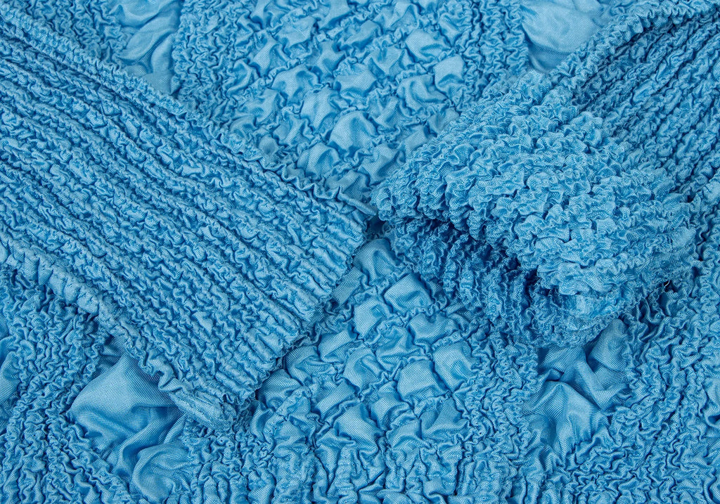 PEPLUM by YOSHIKI HISHINUMA Japan. Sky Blue Shirring High-neck Top