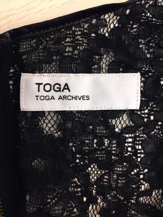 Toga Pulla Archives Japan. Mick sports lace dress