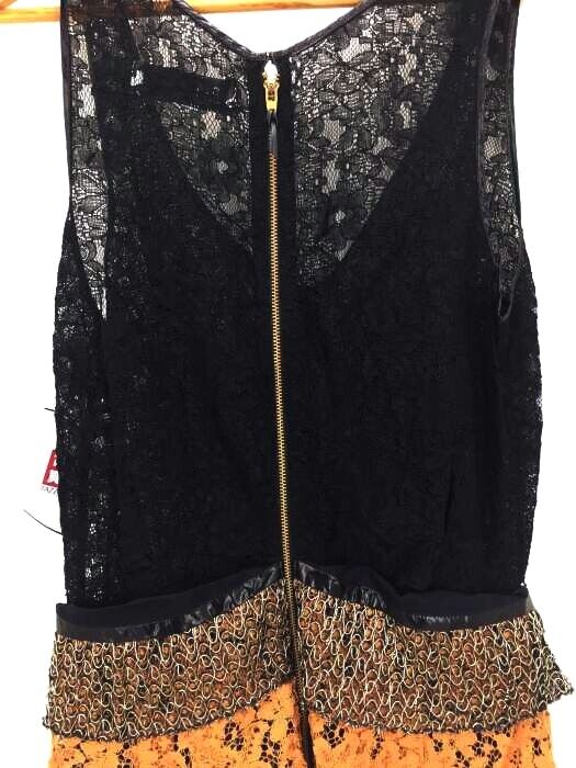 Toga Pulla Archives Japan. Mick sports lace dress