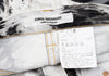 COMME des GARCONS JAPAN. JUNYA WATANABE White, Charcoal, Black Denim Bleach Printed Stretch Slim Pants