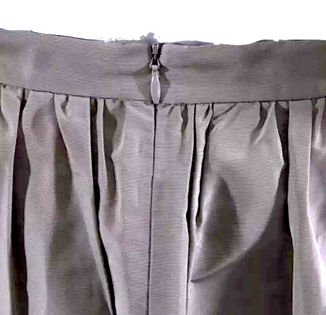 Miu Miu Italy. Khaki Color Textured Nylon Pleated Back Zip Bow Front Midi Skirt