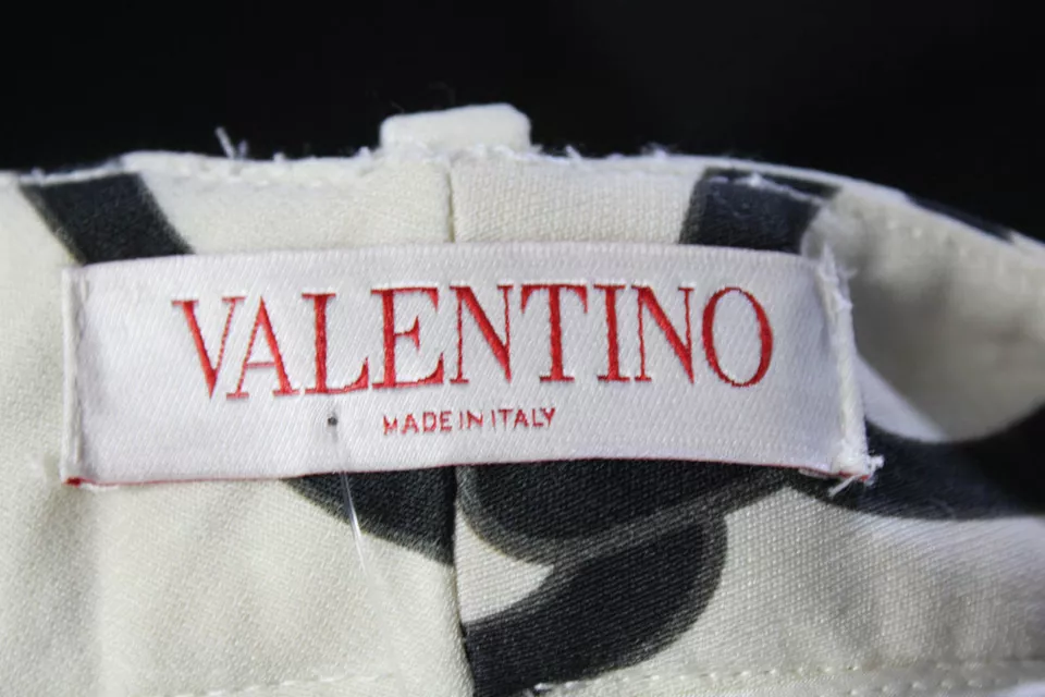 Valentino Garavani Italy White, Black Chain Logo Print Mid Rise Pleated Pants