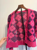 Acne Studios STOCKHOLM. Pink Purple Argyle Face Logo Wool Cardigan