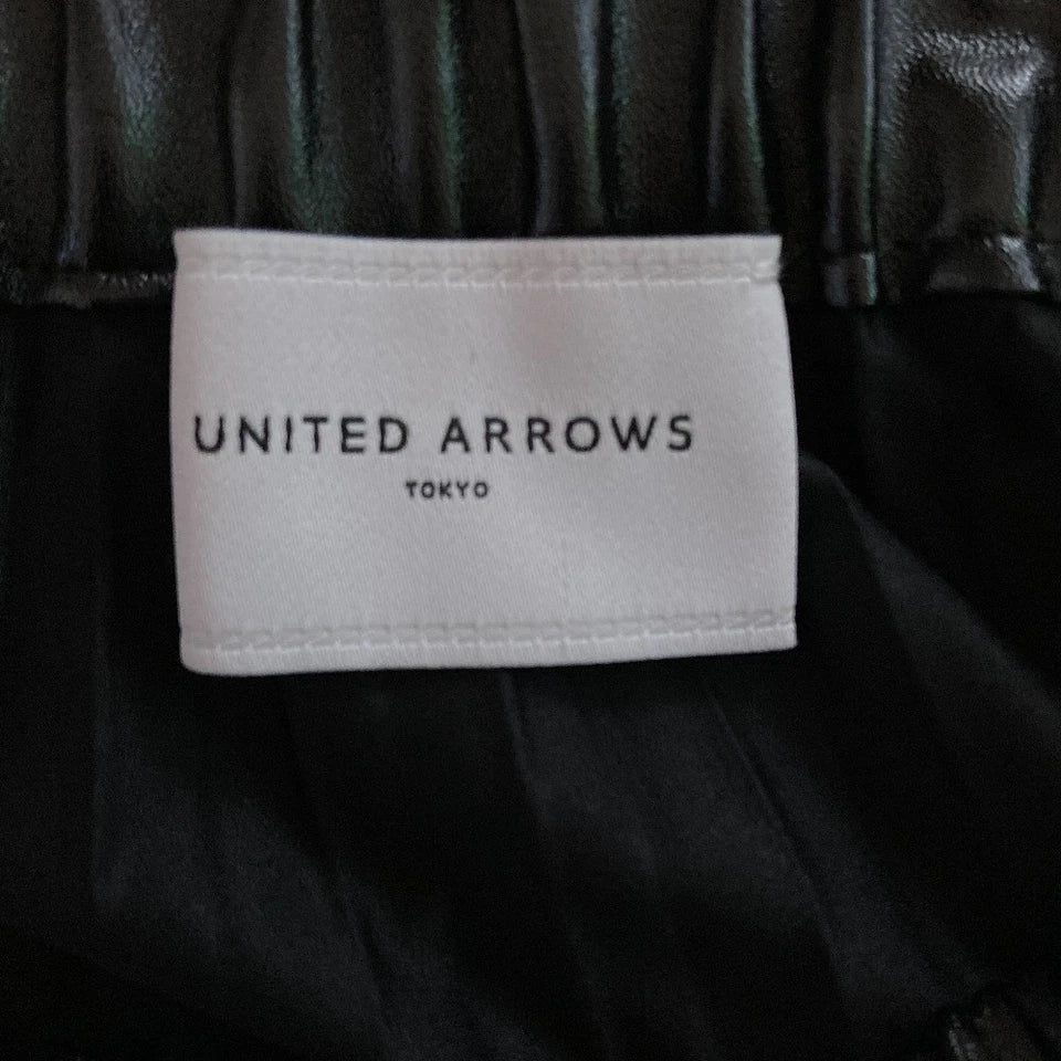 UNITED ARROWS JAPAN. Black Faux Leather Pleated Skirt