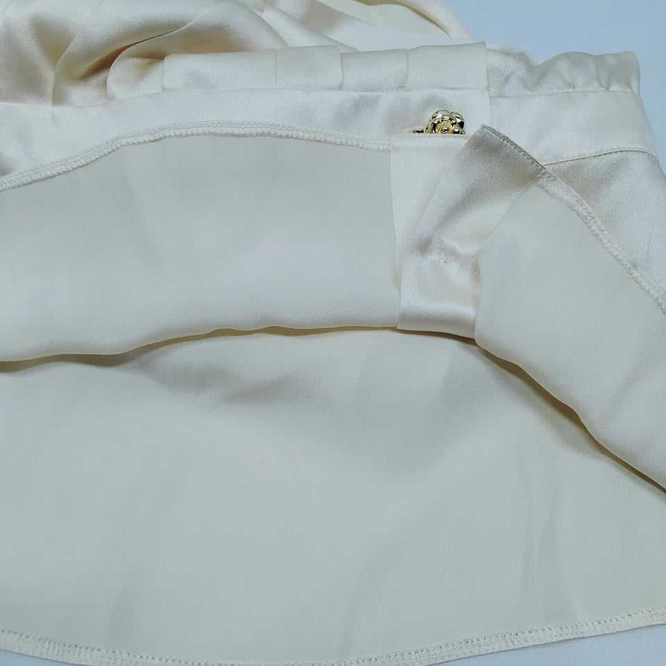 CHANEL PARIS. WHITE/IVORY LINEN CHANEL BUTTONS PLEATED TOP